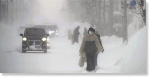 People walk through wind and snow on Monday morning in Shibetsu, Hokkaido. People walk through wind and snow on Monday morning in Shibetsu, Hokkaido.