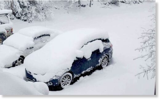 Vehicles buried in more than foot of snow in Ishpeming, Michigan on May 1, 2023. Vehicles buried in more than foot of snow in Ishpeming, Michigan on May 1, 2023.