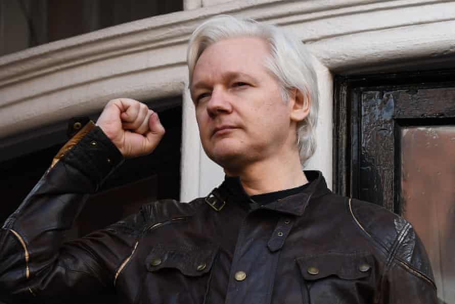 May 19, 2017 Wikileaks founder Julian Assange raises his fist prior to addressing the media on the balcony of the Embassy of Ecuador in London