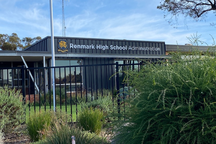 A small, dark-coloured building bearing the lettering Renmark High School Administration.