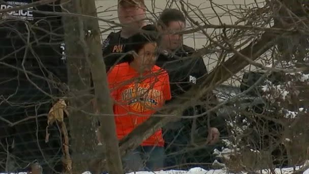 PHOTO: A woman is led in handcuffs from an alleged fentanyl mill in a suburban home in Ardsley, New York (WABC)