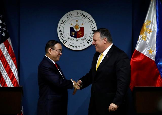 U.S. Secretary of State Mike Pompeo shakes hands with Philippine Foreign Secretary Teodoro Locsin Jr. at the Department of Foreign Affairs in Pasay City, Metro Manila, Philippines, March 1, 2019. REUTERS/Eloisa Lopez