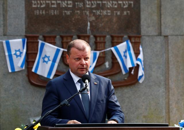 FILE PHOTO: Lithuanian Prime Minister Saulius Skvernelis speaks during the commemoration of victims and award ceremony of the Righteous Among the Nations at the Paneriai Memorial in Vilnius, Lithuania August 24, 2018. REUTERS/Ints Kalnins