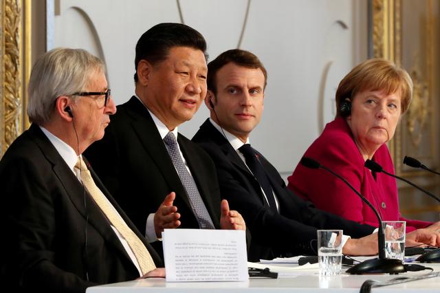 French President Emmanuel Macron, Chinese President Xi Jinping, German Chancellor Angela Merkel and European Commission President Jean-Claude Juncker hold a news conference at the Elysee presidential palace in Paris, France, March 26, 2019. Thibault Camus/Pool via REUTERS