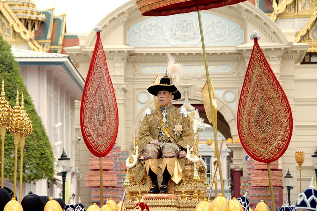Thailand's King Maha Vajiralongkorn is transported on the royal palanquin by royal bearers during his visit to the Temple of the Emerald Buddha to proclaim himself the Royal Patron of Buddhism, inside the Grand Palace in Bangkok, Thailand, May 4, 2019. The Committee on Public Relations of the Coronation of King Rama X/Handout via REUTERS 