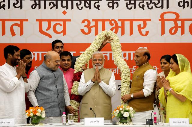 India's Prime Minister Narendra Modi gestures as he is presented with a garland during a thanksgiving ceremony by Bharatiya Janata Party (BJP) leaders to its allies at the party headquarters in New Delhi, India, May 21, 2019. REUTERS/Anushree Fadnavis