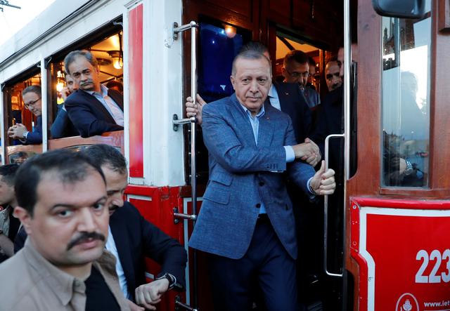 FILE PHOTO - Turkish President Tayyip Erdogan gets off a vintage tram at Taksim Square in central Istanbul, Turkey, May 12, 2019. REUTERS/Murad Sezer