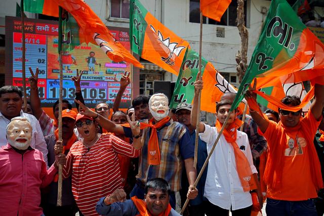 Supporters of Bharatiya Janata Party (BJP) celebrate after learning of initial poll results in Ahmedabad, India, May 23, 2019. REUTERS/Amit Dave
