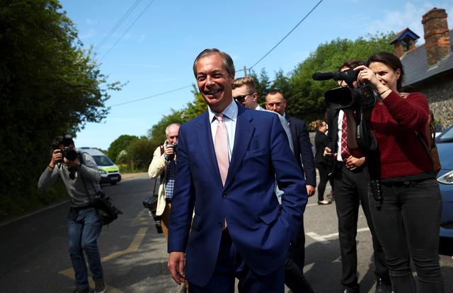 Brexit Party leader Nigel Farage leaves a polling station after voting in the European elections, in Biggin Hill, Britain, May 23, 2019. REUTERS/Hannah McKay