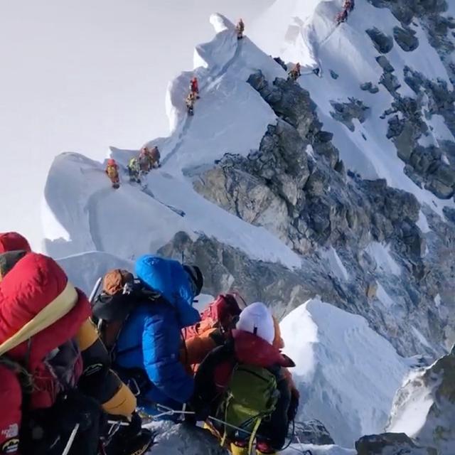 Climbers descend from the summit of Everest down the Hillary Step and across the cornice traverse to the South Summit, Nepal May 23, 2019 in this picture obtained from social media on May 27, 2019. CLIMBING THE SEVEN SUMMITS/@TENDIGUIDE/via REUTERS 