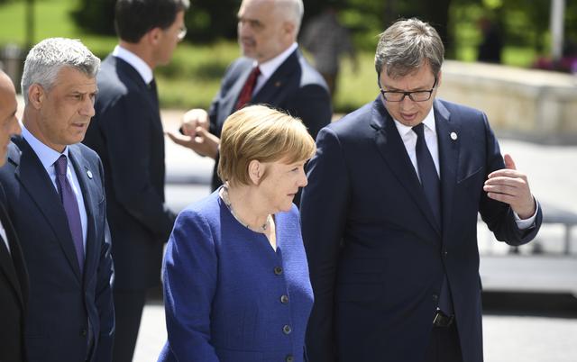 FILE PHOTO: Germany's Chancellor Angela Merkel, Kosovo's President Hashim Thaci and Serbian President Aleksandar Vucic pose among other heads of state during the family photo at the EU-Western Balkans Summit in Sofia, Bulgaria, May 17, 2018. Vassil Donev/Pool via Reuters/File Photo 
