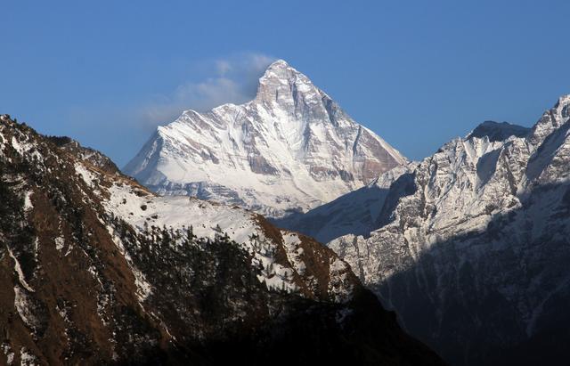 FILE PHOTO: Snow-covered Nanda Devi mountain is seen from Auli town, in the northern Himalayan state of Uttarakhand, India February 25, 2014. Picture taken February 25, 2014. REUTERS/Stringer