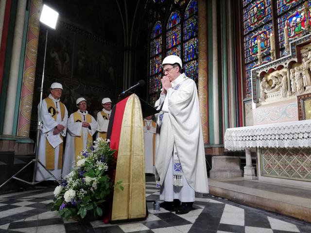 The Archbishop of Paris Michel Aupetit leads the first mass in a side chapel two months to the day after a devastating fire engulfed the Notre-Dame de Paris cathedral, in Paris, France June 15, 2019. Karine Perret/Pool via REUTERS