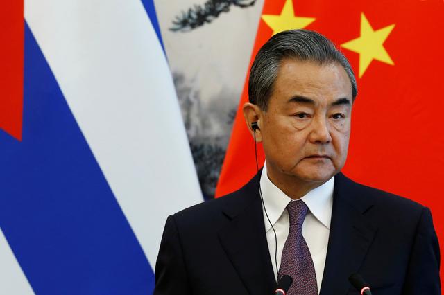 FILE PHOTO: Chinese Foreign Minister Wang Yi attends a news conference with Cuban Foreign Minister Bruno Rodriguez (not pictured) at Diaoyutai state guesthouse in Beijing, China May 29, 2019. REUTERS/Florence Lo