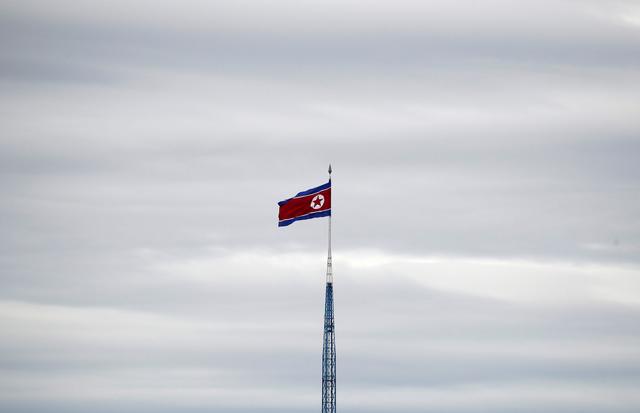 A North Korean flag flutters on top of a 160-metre tower in North Korea's propaganda village of Gijungdong, in this picture taken from the Tae Sung freedom village near the Military Demarcation Line (MDL), inside the demilitarised zone separating the two Koreas, in Paju, South Korea, April 24, 2018. REUTERS/Kim Hong-Ji