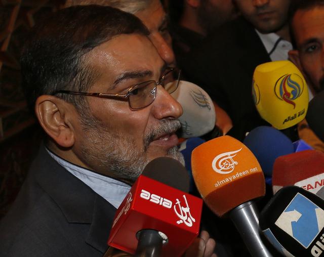 FILE PHOTO: Admiral Ali Shamkhani, Iran's Supreme National Security Council Director, speaks to the media after his arrival at Damascus airport, September 30, 2014. REUTERS/Khaled al-Hariri 