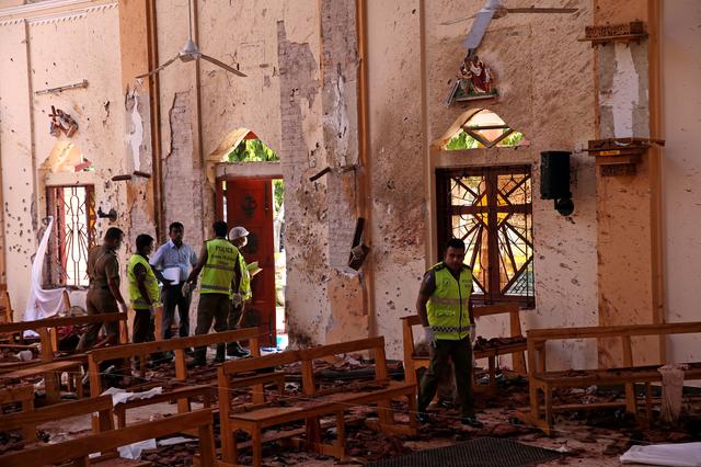 FILE PHOTO: Police officers work at the scene at St. Sebastian Catholic Church, after bomb blasts ripped through churches and luxury hotels on Easter, in Negombo, Sri Lanka April 22, 2019. REUTERS/Athit Perawongmetha/File Photo