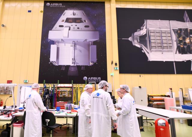 FILE PHOTO: Employees chat at a production line of Airbus' European Service Module (ESM), which is delivered for NASA's Orion Spaceship, at the Airbus plant in Bremen, Germany, February 19, 2019. Picture taken February 19,2019. REUTERS/Fabian Bimmer/File Photo
