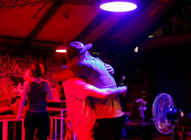 People dance in a bar where LGBT community gathers in Skopje, North Macedonia June 25, 2019.Picture taken on June 25, 2019.REUTERS/Ognen Teofilovski