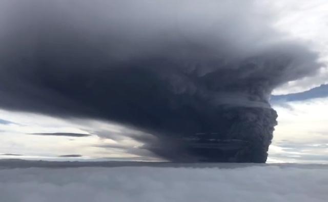FILE PHOTO - Ash billows from Mount Ulawun during a volcanic eruption, West New Britain, Papua New Guinea June 26, 2019 in this still image taken from social media video. Eroli Tamara via REUTERS 