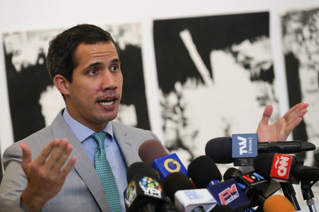 Venezuelan opposition leader Juan Guaido, who many nations have recognised as the country's rightful interim ruler, talks to the media during a news conference before a meeting with representatives of Venezuela's private industrial sector in Caracas, Venezuela June 26, 2019. REUTERS/Fausto Torrealba 
