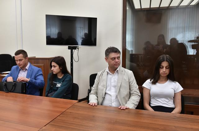 Angelina (R) and Maria (2nd-L) Khachaturyan, two of three Khachaturyan sisters, who accused of killing their father, attend the court hearing in Moscow, Russia June 26, 2019.  REUTERS/Kommersant Photo/Dmitry Lebedev 