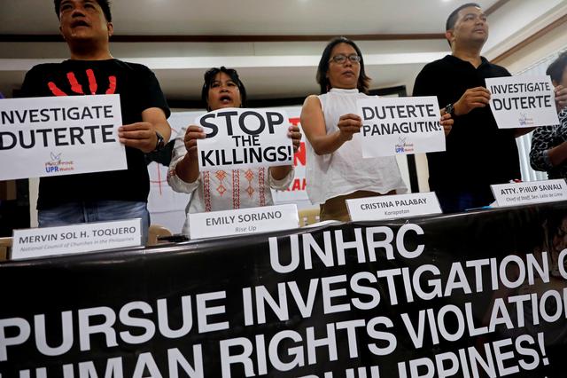 Members of the human rights groups hold banners calling to investigate Philippine President Rodrigo Dutere, during a news conference in Quezon City, Metro Manila, Philippines July 12, 2019. REUTERS/Eloisa Lopez