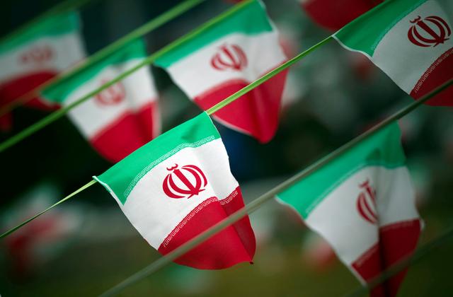 FILE PHOTO: Iran's national flags are seen on a square in Tehran February 10, 2012, a day before the anniversary of the Islamic Revolution. REUTERS/Morteza Nikoubazl