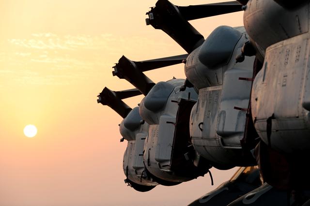 Wings of MV-22 Osprey aircrafts are seen during sunset on the flight deck of USS Boxer (LHD-4) in the Arabian Sea off Oman July 16, 2019. Picture taken July 16, 2019. REUTERS/Ahmed Jadallah