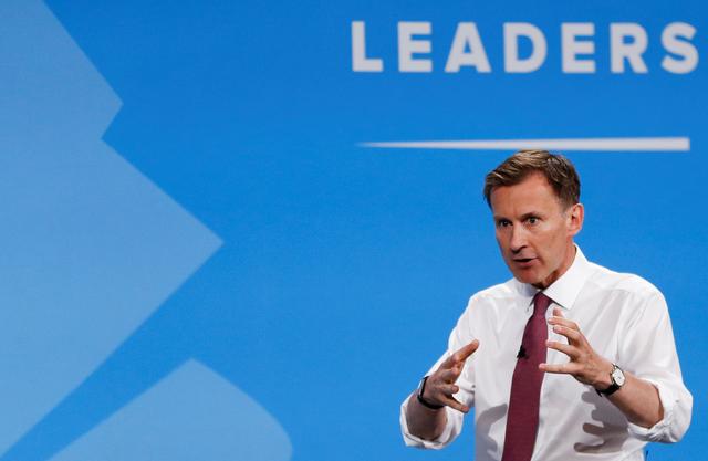 FILE PHOTO: Jeremy Hunt, a leadership candidate for Britain's Conservative Party, gestures as he attends a hustings event in London, Britain July 17, 2019. REUTERS/Peter Nicholls