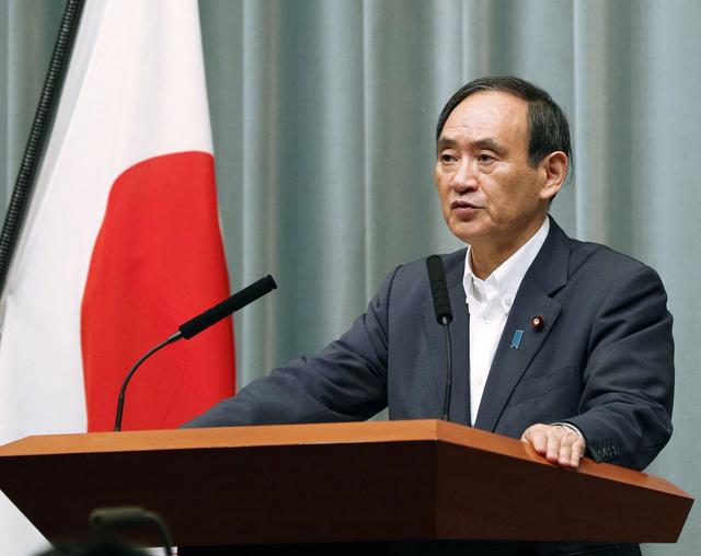 FILE PHOTO: Japan's Chief Cabinet Secretary Yoshihide Suga speaks at a news conference about North Korea's missile launch in Tokyo, Japan in this photo taken by Kyodo on September 15, 2017.  Kyodo/via REUTERS/File Photo