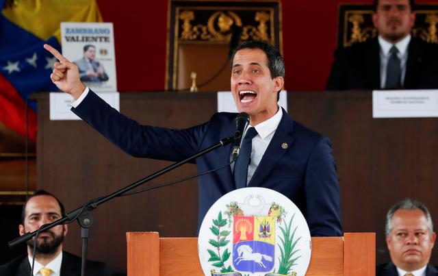 Venezuelan opposition leader Juan Guaido, who many nations have recognised as the country's rightful interim ruler, gestures as he speaks during a session of Venezuela’s National Assembly at a public square in Caracas, Venezuela July 23, 2019. REUTERS/Carlos Garcia Rawlins
