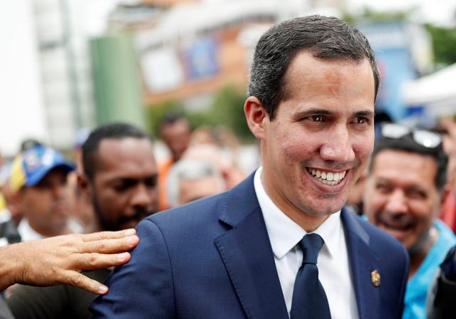 FILE PHOTO: Venezuelan opposition leader Juan Guaido, who many nations have recognised as the country's rightful interim ruler, leaves after a session of Venezuela’s National Assembly at a public square in Caracas, Venezuela July 23, 2019. REUTERS/Carlos Garcia Rawlins