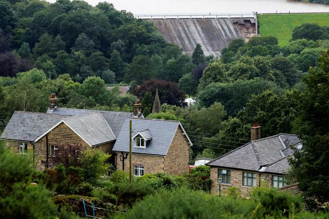 A damaged dam is seen after a nearby reservoir was affected by flooding, in Whaley Bridge, Britain August 1, 2019. REUTERS/Phil Noble