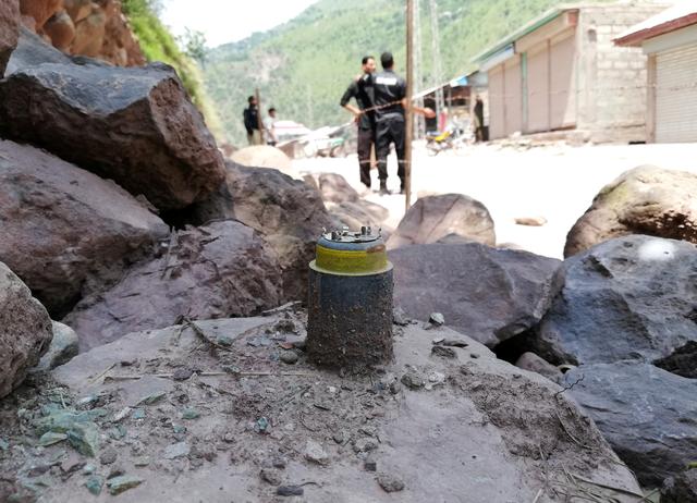 A cluster bomb shell is seen along a roadside in Noseri, near the line of control (LOC), in Neelum Valley in Kashmir August 4, 2019. REUTERS/M. Saif ul Islam