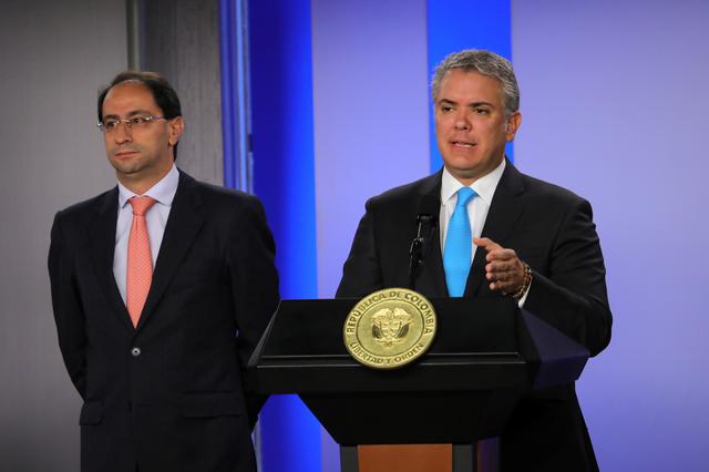 Colombian President Ivan Duque addresses the audience about VAT fraud 'cartel' next to Minister of Commerce Jose Manuel Restrepo, in Bogota, Colombia August 8, 2019. Courtesy of Colombian Presidency/Handout via REUTERS 