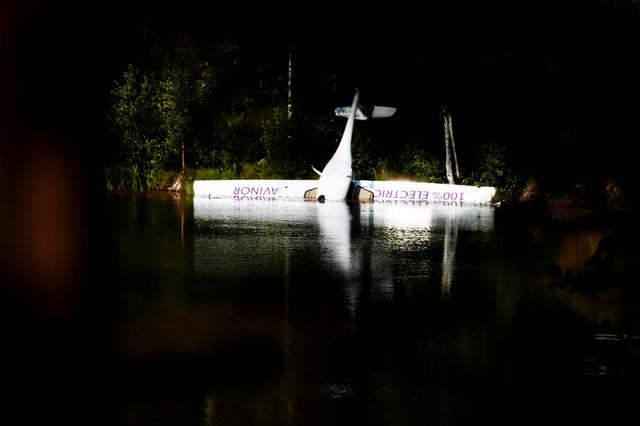 Norway's first battery-powered aircraft piloted by Avinor Chief Executive Dag Falk-Petersen is seen partly submerged in a lake after crash-landing, in Nornestjonn, Arendal, Norway, August 14, 2019. NTB Scanpix/Hakon Mosvold Larsen via REUTERS  