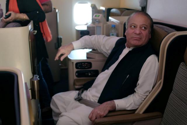 FILE PHOTO: Ousted Pakistani Prime Minister Nawaz Sharif sits on a plane after landing at the Allama Iqbal International Airport in Lahore, Pakistan, July 13, 2018. REUTERS/ Drazen Jorgic