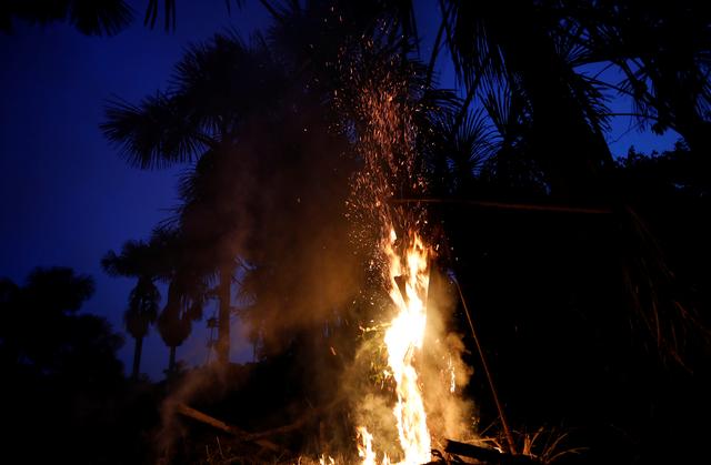FILE PHOTO: A tract of the Amazon jungle burns as it is cleared in Iranduba, Amazonas state, Brazil August 22, 2019. REUTERS/Bruno Kelly