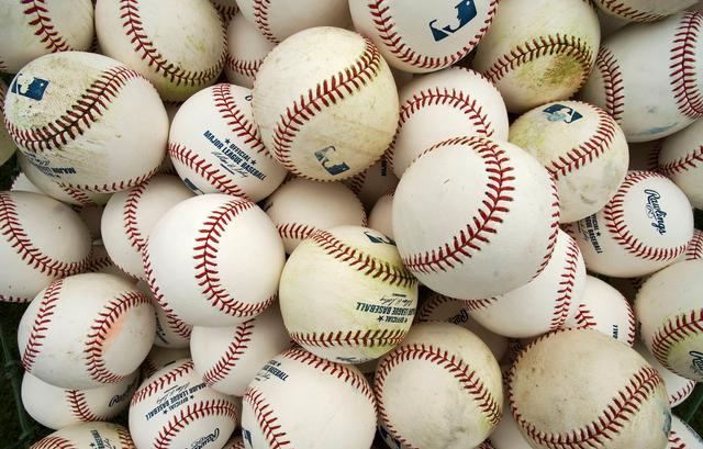 FILE PHOTO: A basket of balls are pictured during a workout session at the Baltimore Orioles infield practice before a MLB spring training baseball game with the Philadelphia Phillies in Sarasota, Florida, March 23, 2013.  REUTERS/Steve Nesius/File Photo