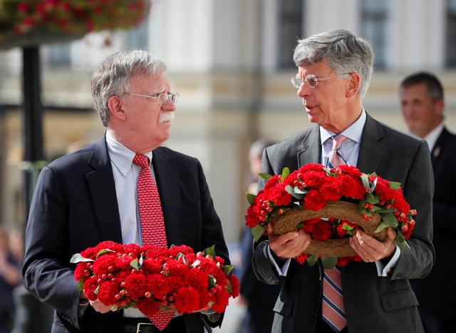 U.S. National Security Adviser John Bolton and U.S. Embassy Charge d'Affairs William Taylor attend a wreath-laying ceremony at the memorial for soldiers killed in a recent conflict in eastern Ukraine, in Kiev, Ukraine August 27, 2019.  REUTERS/Gleb Garanich