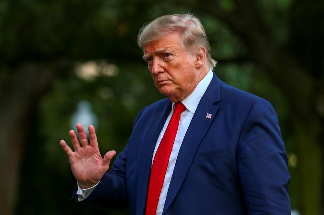 FILE PHOTO: U.S. President Donald Trump returns after travelling to the AMVETS convention in Kentucky, at the South Lawn of the White House in Washington, U.S. August 21, 2019. REUTERS/Tasos Katopodis/File Photo