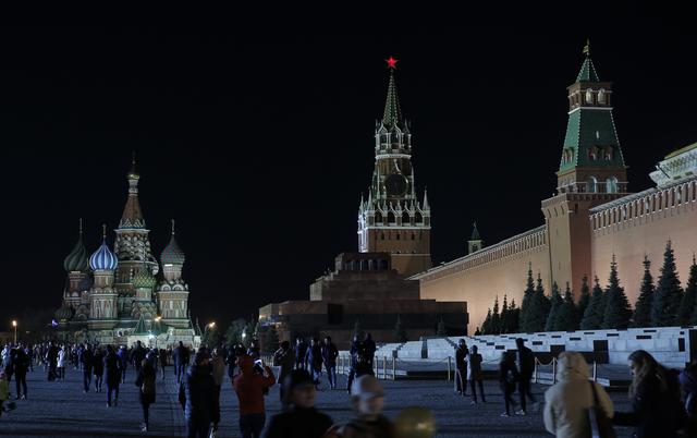 FILE PHOTO - A view shows the St. Basil's Cathedral (L) and the Kremlin wall, before the lights were switched off for Earth Hour in Red Square in central Moscow, Russia, March 25, 2017. REUTERS/Maxim Shemetov 