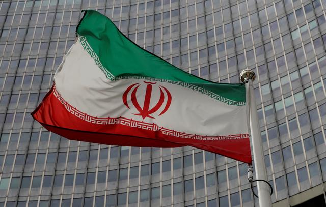 FILE PHOTO: An Iranian flag flutters in front of the International Atomic Energy Agency (IAEA) headquarters in Vienna, Austria September 9, 2019. REUTERS/Leonhard Foeger