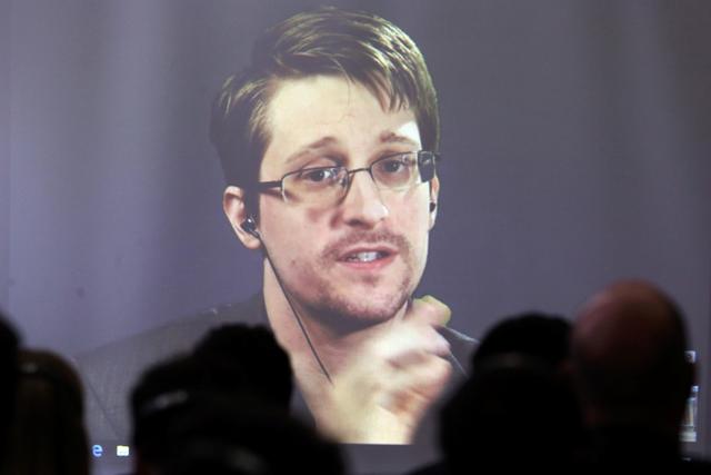 FILE PHOTO: Edward Snowden speaks via video link during a conference at University of Buenos Aires Law School, Argentina, November 14, 2016. REUTERS/Marcos Brindicci