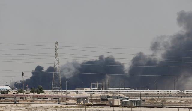 FILE PHOTO: Smoke is seen following a fire at Aramco facility in the eastern city of Abqaiq, Saudi Arabia, September 14, 2019. REUTERS/Stringer/File Photo