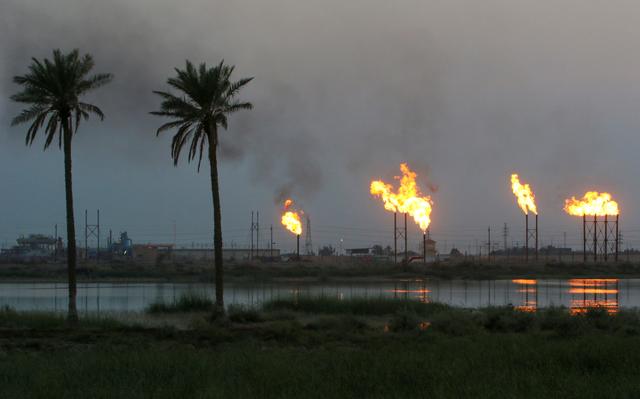 Flames emerge from flare stacks at Nahr Bin Umar oil field, north of Basra, Iraq September 16, 2019. REUTERS/Essam Al-Sudani