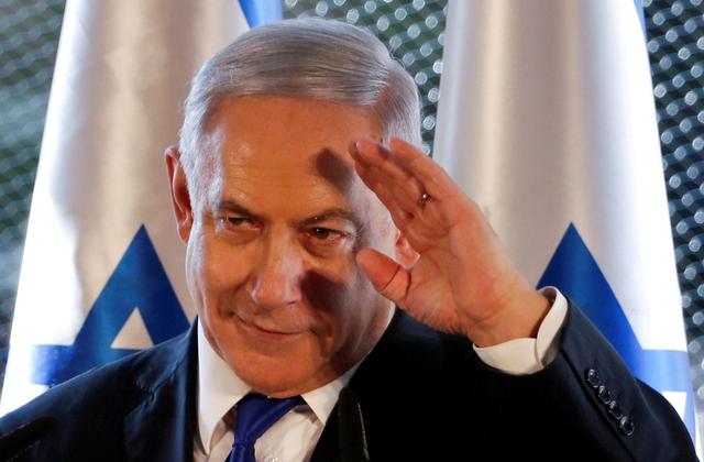 FILE PHOTO: Israeli Prime Minister Benjamin Netanyahu gestures as he speaks during a state memorial ceremony at the Tomb of the Patriarchs, a shrine holy to Jews and Muslims, in Hebron in the Israeli-occupied West Bank September 4, 2019. REUTERS/Ronen Zvulun/File Photo