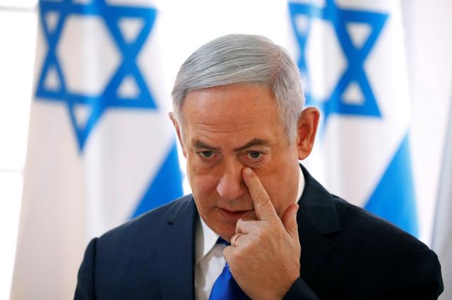 FILE PHOTO: Israeli Prime Minister Benjamin Netanyahu gestures during a weekly cabinet meeting in the Jordan Valley, in the Israeli-occupied West Bank September 15, 2019. REUTERS/Amir Cohen/File Photo