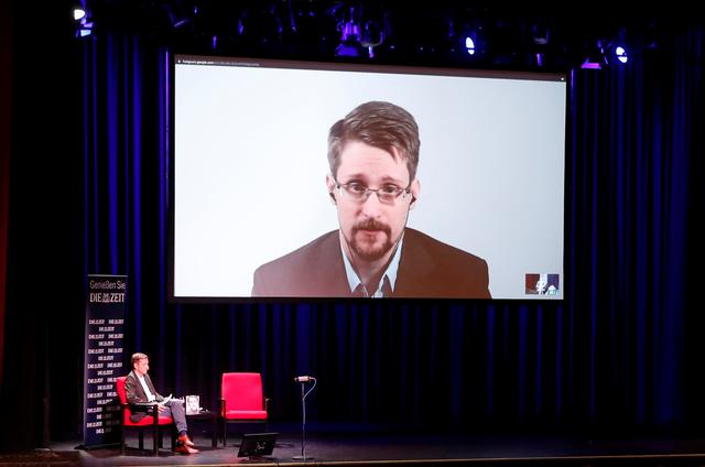 Edward Snowden speaks via video link as he takes part in a discussion about his book Permanent Record with German journalist Holger Stark in Berlin, Germany, September 17, 2019. REUTERS/Fabrizio Bensch